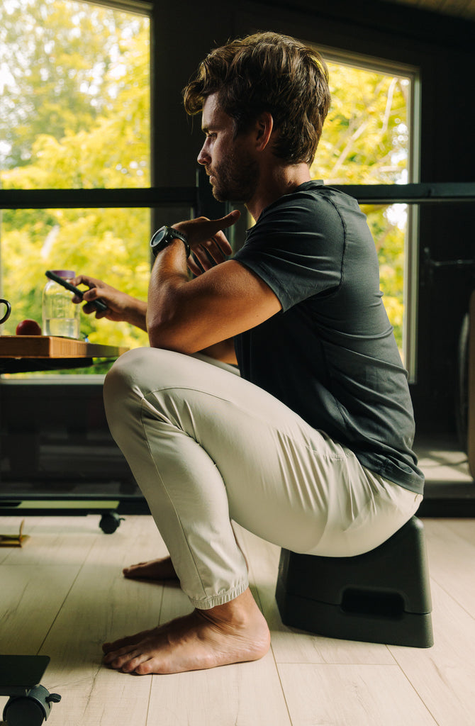 man demonstrating a SquatSeat use
